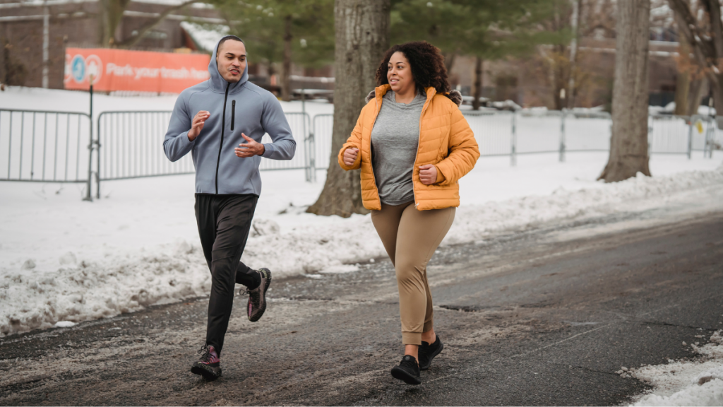 two runners jogging down the street to exemplify the importance of building healthy habits while on weight loss injections